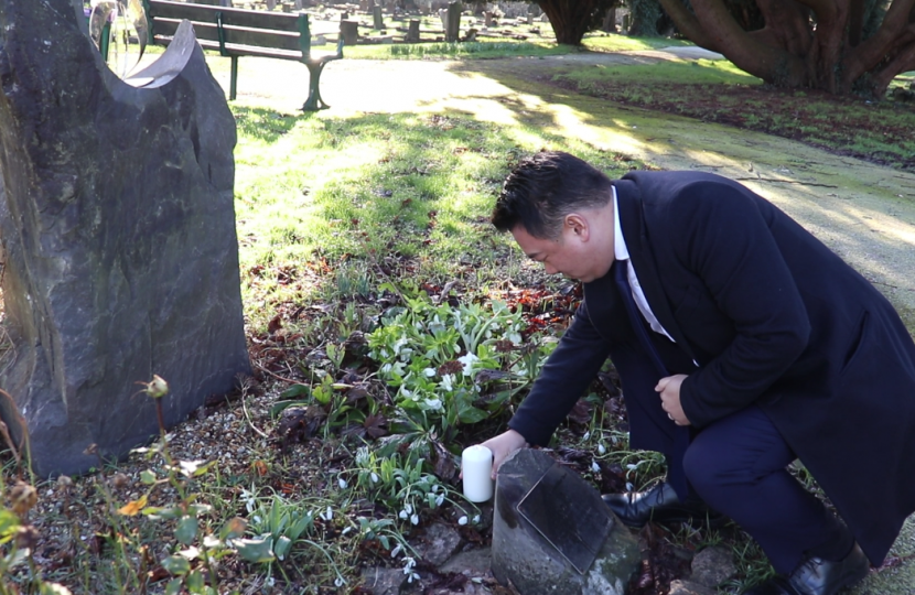 Local MP Alan Mak reflects on the victims of the Holocaust at the Holocaust Memorial in Havant Cemetery.