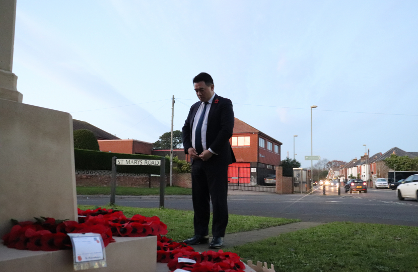 Local MP Alan Mak pays his respects at the Cenotaph on Elm Grove in Mengham.