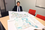 Alan Mak MP with a previous version of Havant Borough Council's Local Plan 