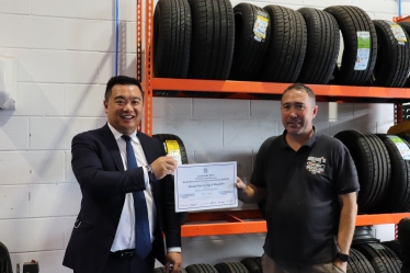 Local MP Alan Mak met Dean at the repair shop to present him with the Small Business Award