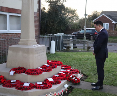 Local MP Alan Mak pays his respects at the Cenotaph on Elm Grove in Mengham.