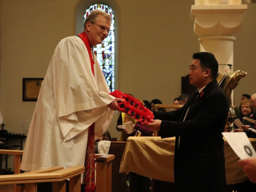 Local MP Alan Mak takes part in Remembrance Sunday service at St James' Church in Emsworth